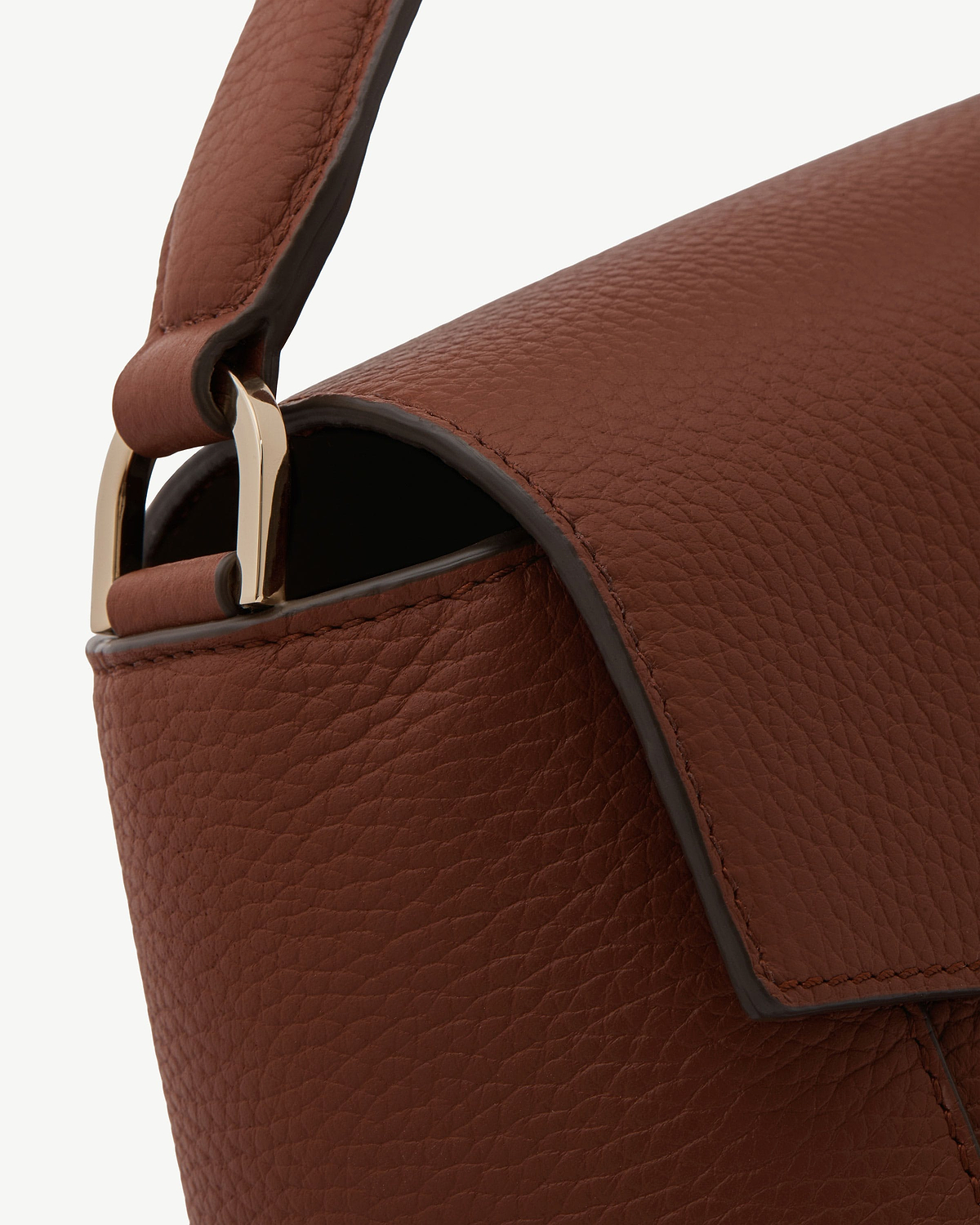 Walnut pebbled leather bag flap, strap, edge trim and gold buckle hardware.