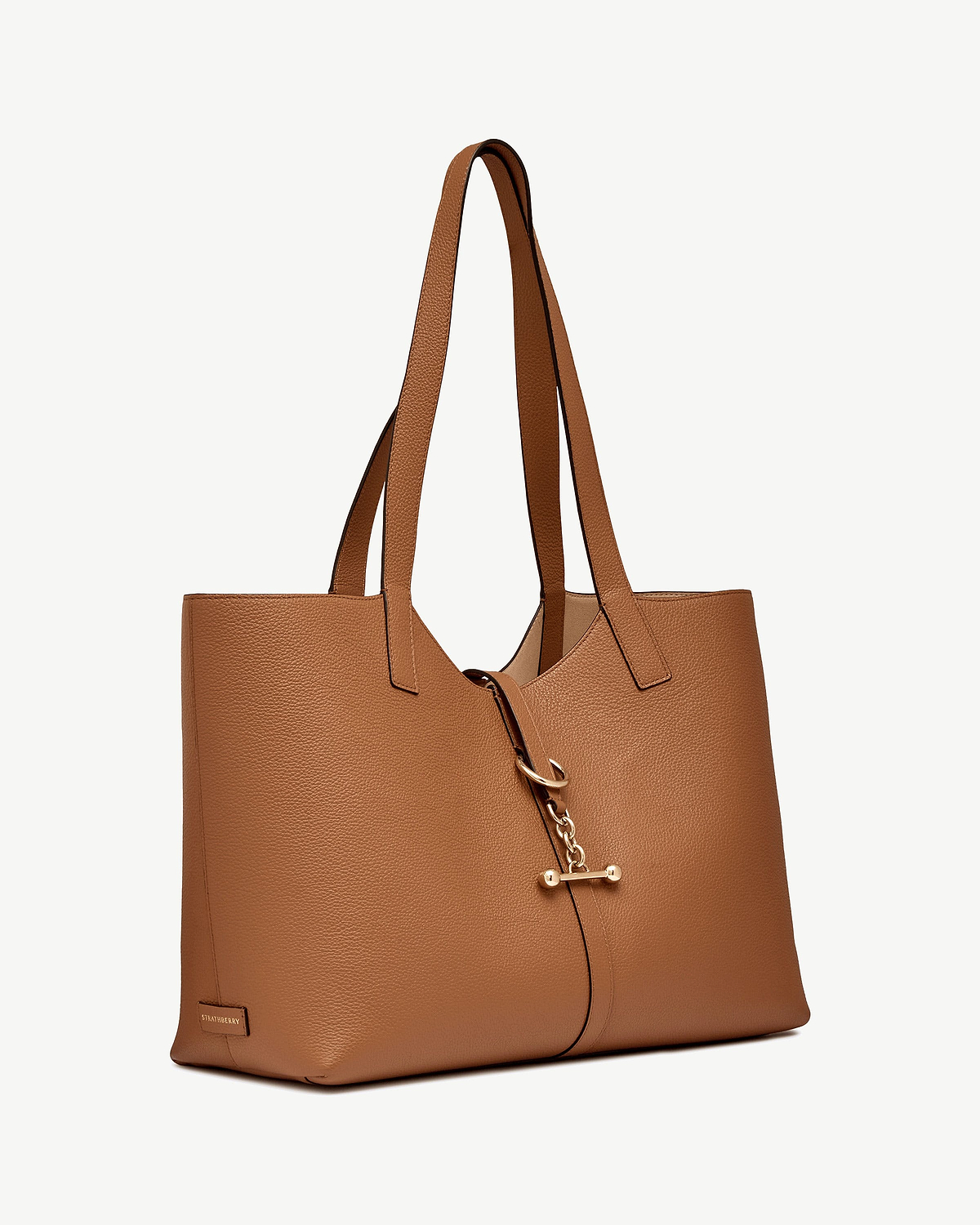 Strathberry Kite tote in tan grained leather with gold chain fastener.