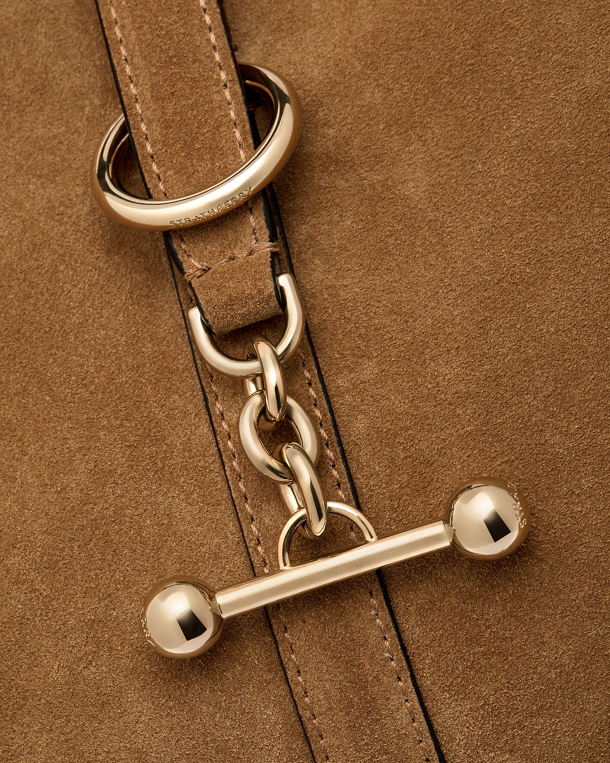 Toffee suede Kite Hobo strap with gold hardware and visible Strathberry logo.
