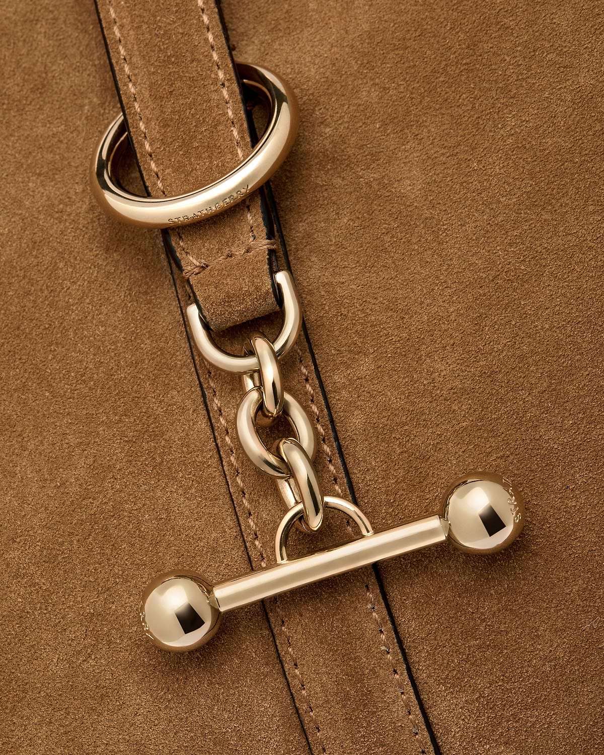 Toffee suede Kite Hobo strap with gold hardware and visible Strathberry logo.