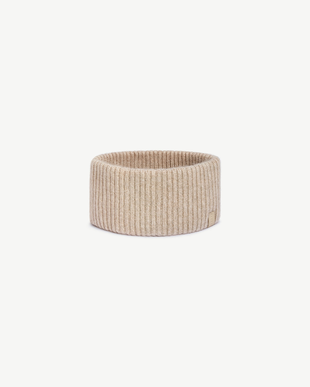 Oat ribbed cashmere headband on white background, top opening visible.