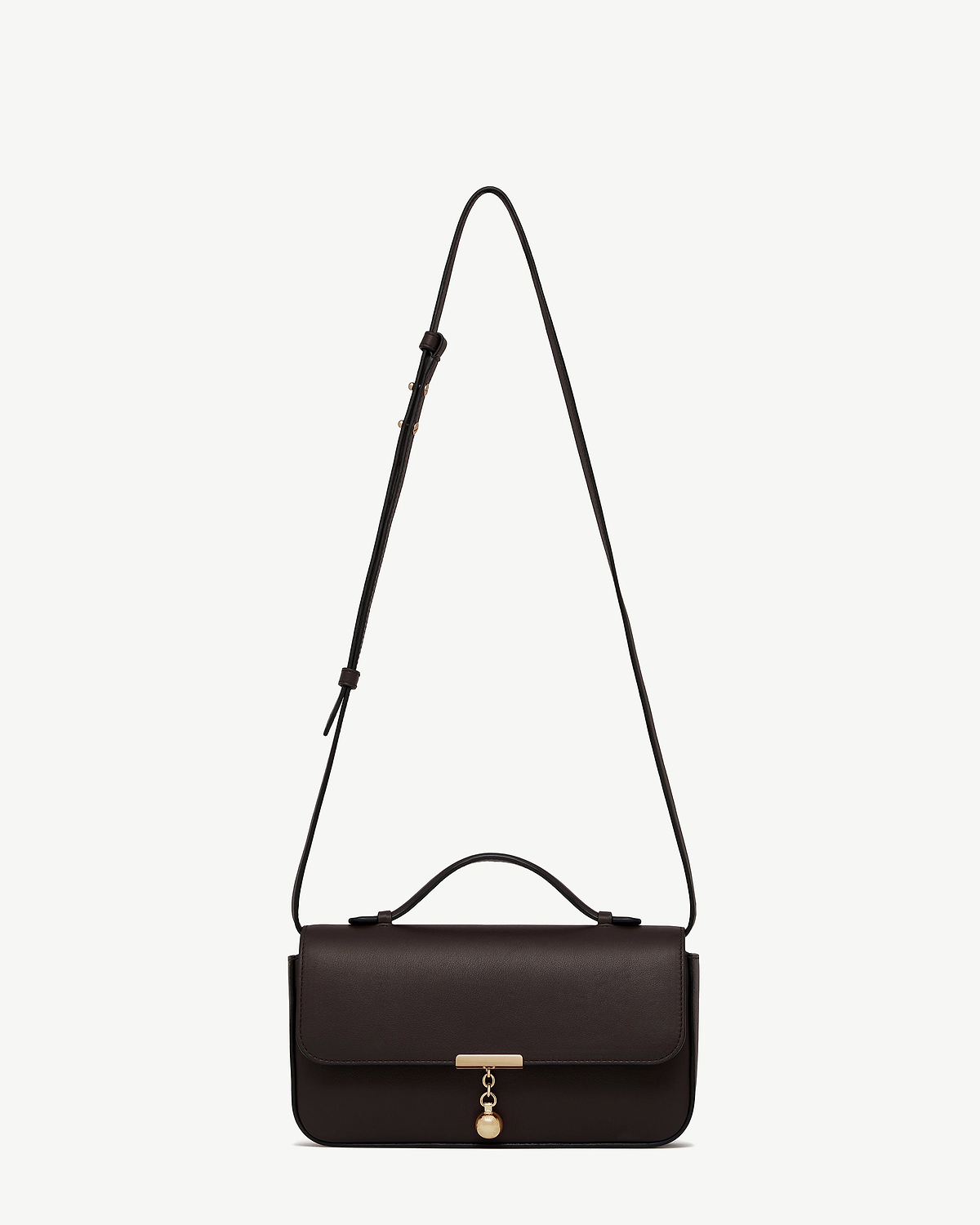 Espresso leather Nocturn clutch with top handle, adjustable shoulder strap and gold charm.