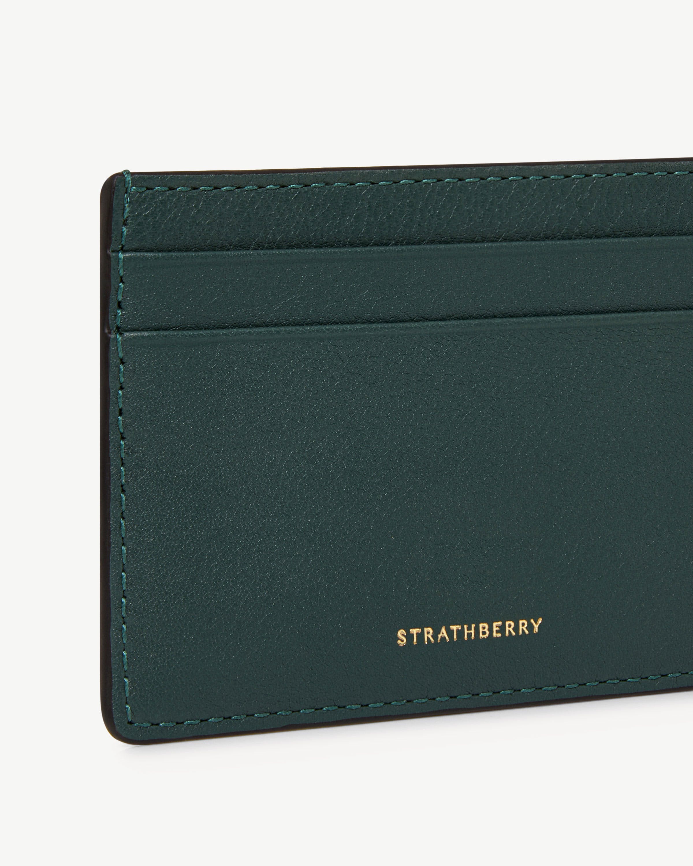 Bottle green leather cardholder corner with card slots and gold Strathberry logo