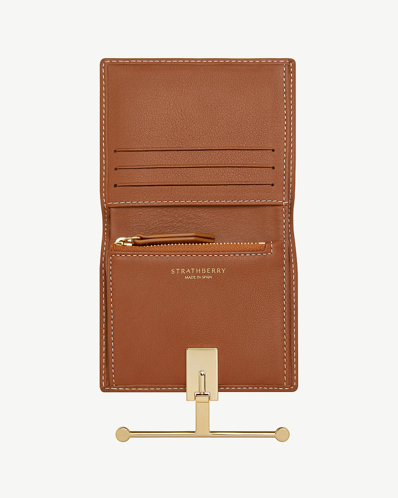 Strathberry Melville Street wallet in chestnut leather with vanilla stitching, open, gold clasp.