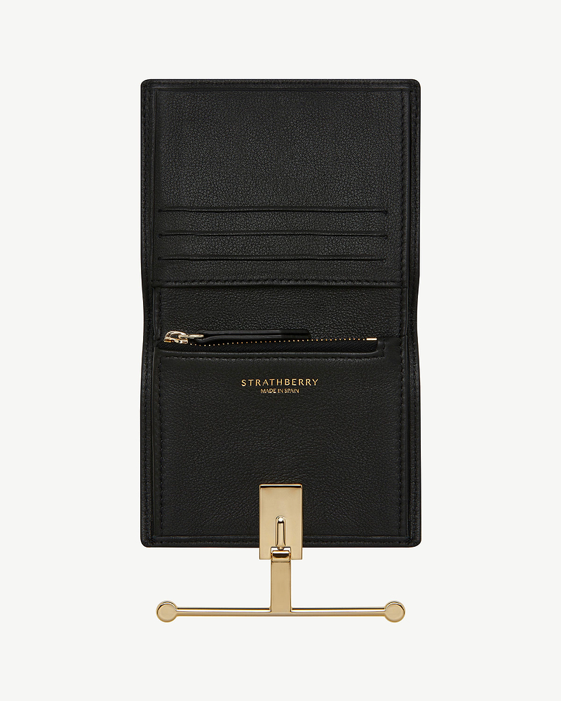 Black Strathberry Melville Street wallet open showing card slots and gold hardware.