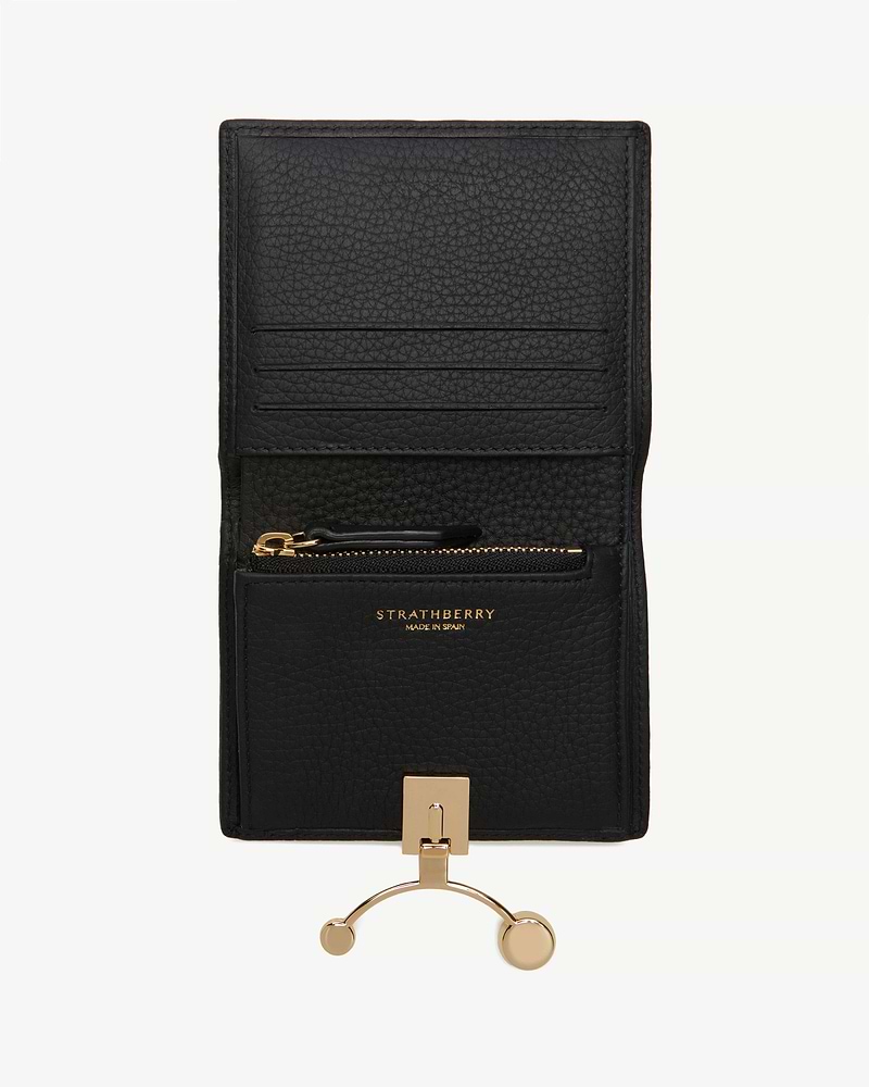 Black Strathberry crescent wallet open with card slots, zip pocket, gold hardware.