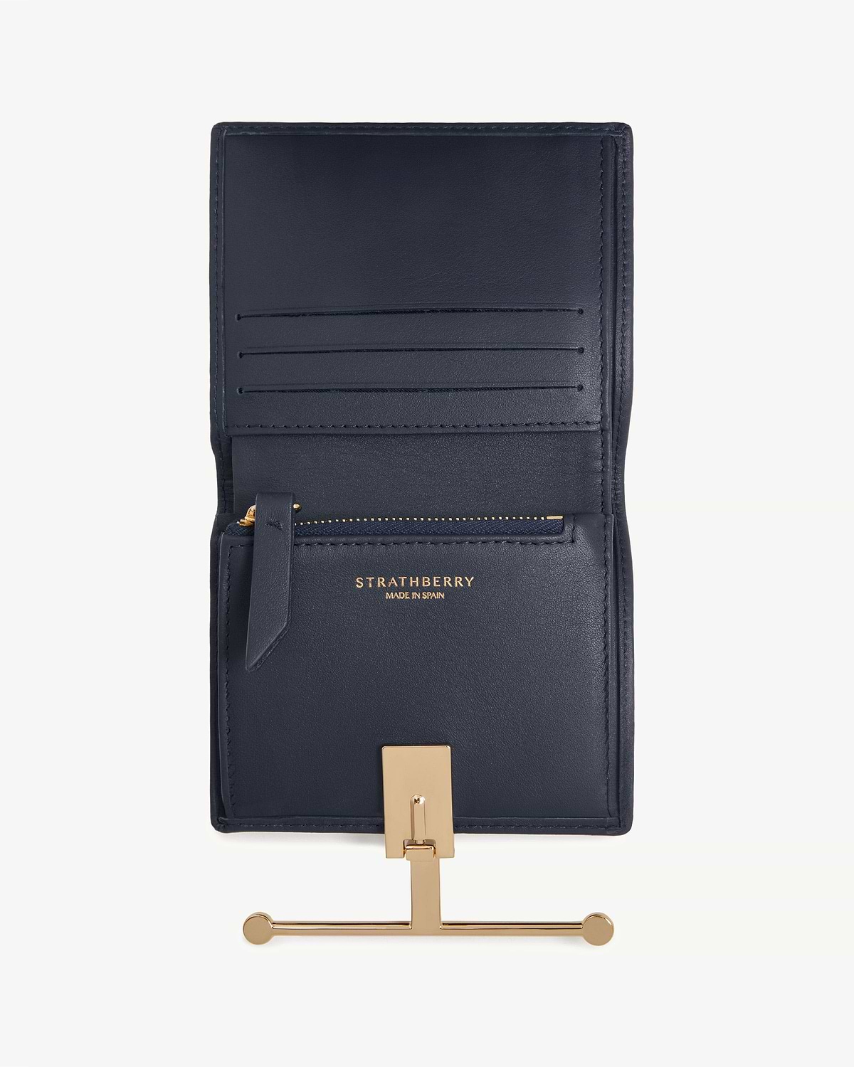 Open marine blue Strathberry Melville Street wallet showing card slots and gold bar closure.