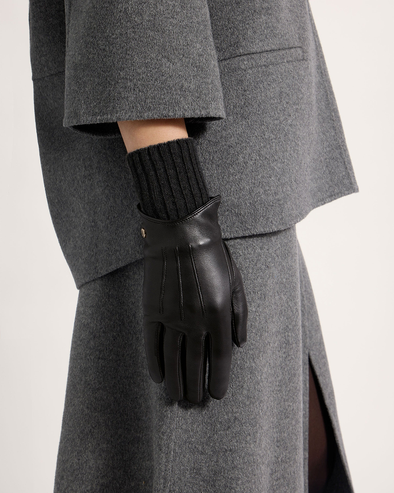 Black leather gloves with ribbed knit cuff worn with grey coat and skirt