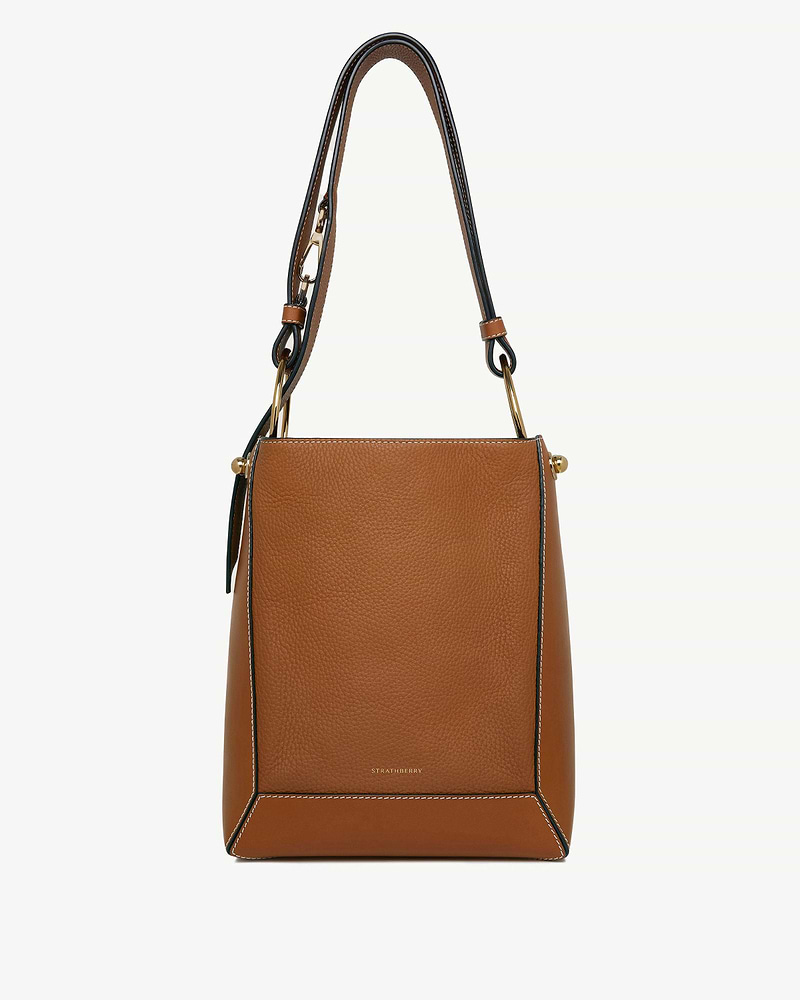 Tan Strathberry Lana midi bucket bag with vanilla contrast stitching.