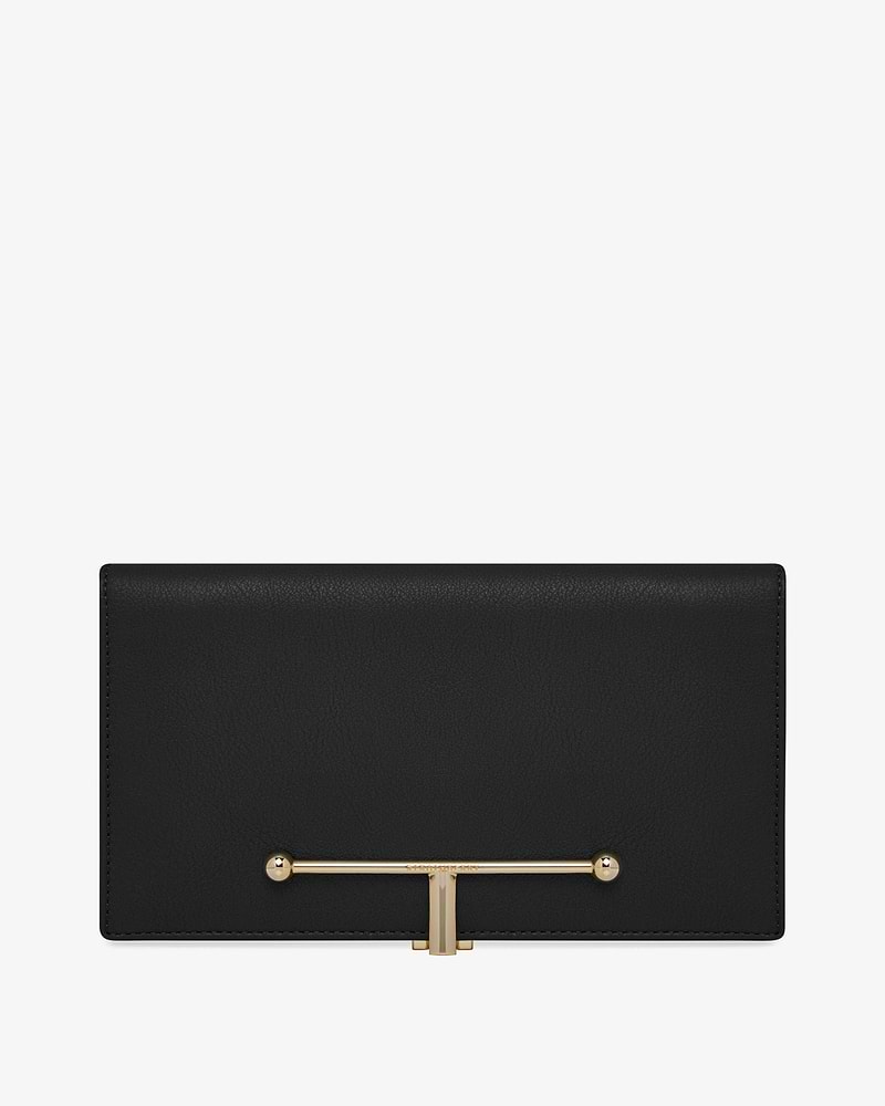 Large black leather wallet with horizontal gold T-bar closure on front.