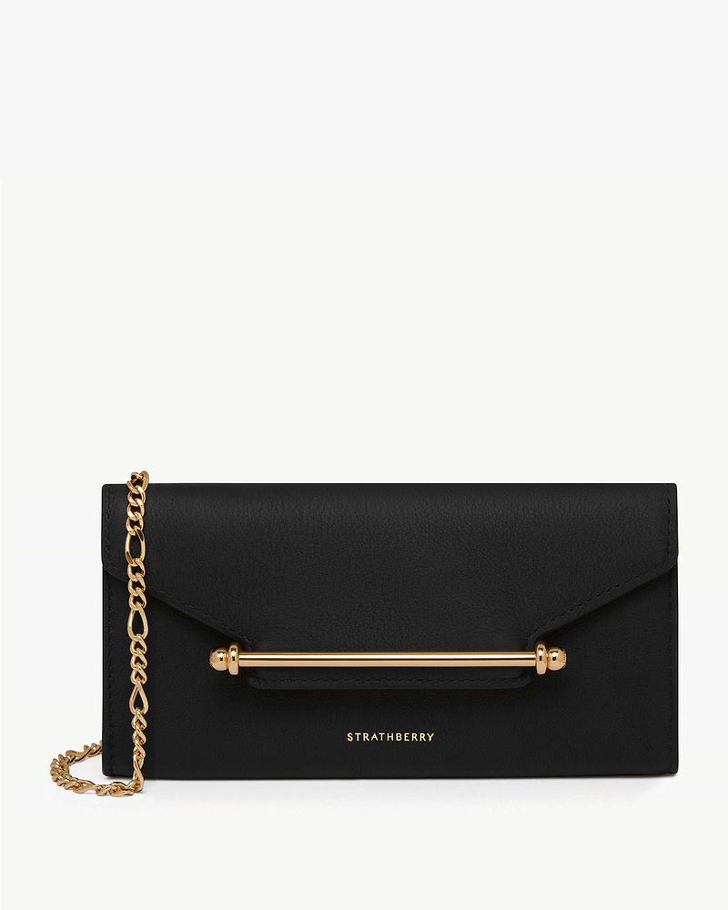 Black Strathberry Multrees chain wallet with gold bar and chain strap.