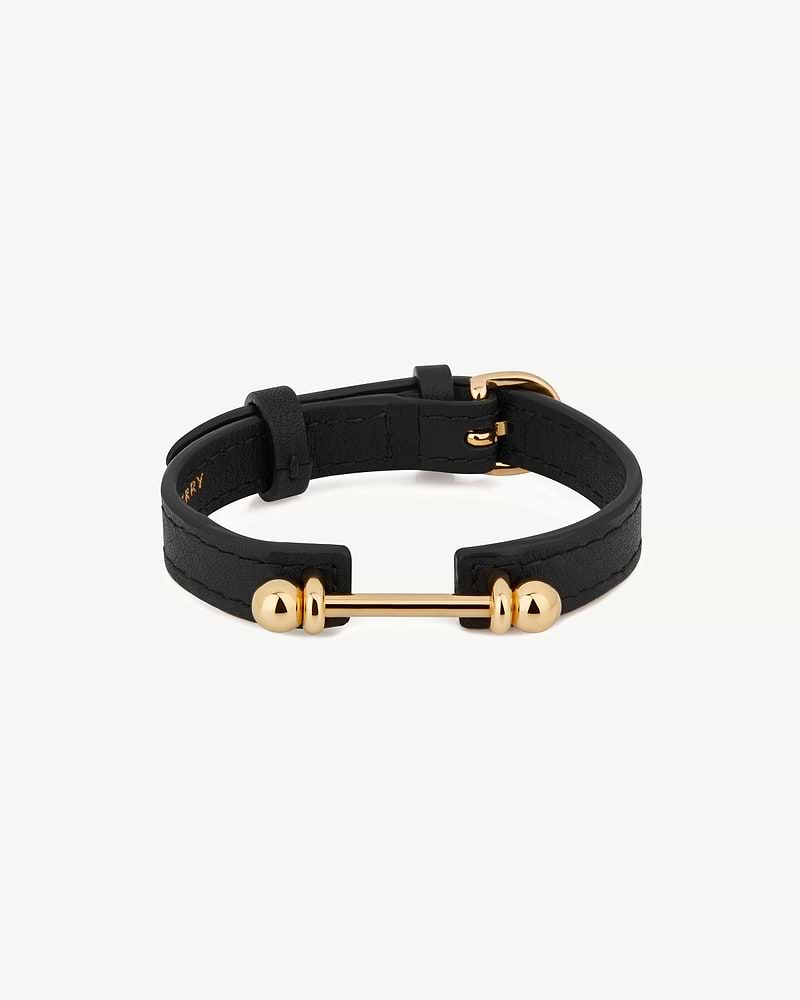 Black leather bracelet with 22-carat gold bar centre and gold buckle fastening.
