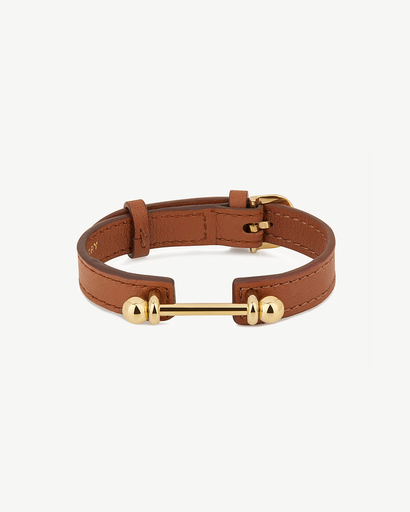 Chestnut leather music bar bracelet with 22-carat gold-gilded bar and buckle.