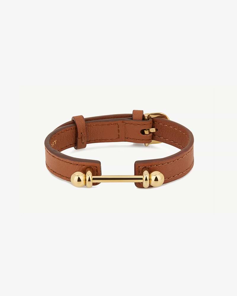 Chestnut leather music bar bracelet with 22-carat gold-gilded bar and buckle.