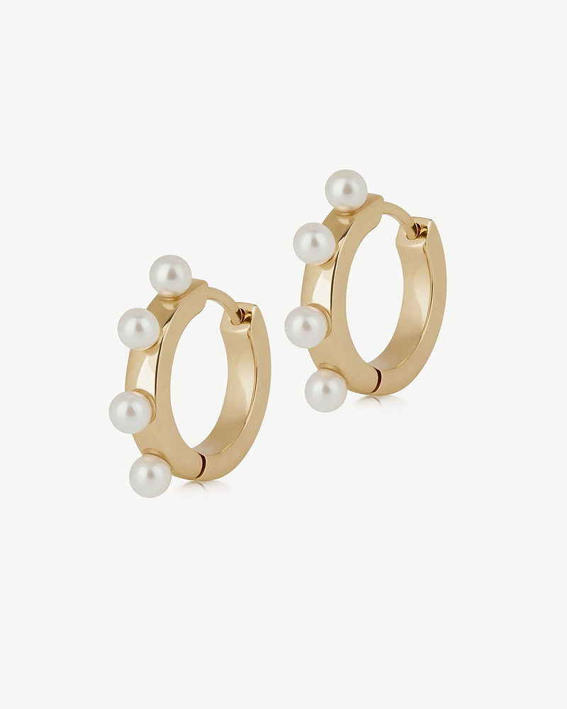 Pair of gold-gilded hoop earrings with small white pearls on each hoop