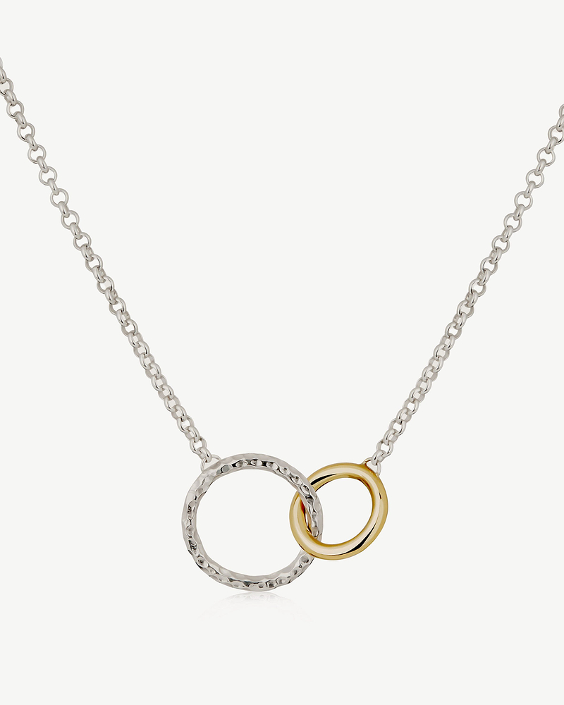 Sterling silver chain with hammered silver halo and 24ct gold-gilded interlocking ring.