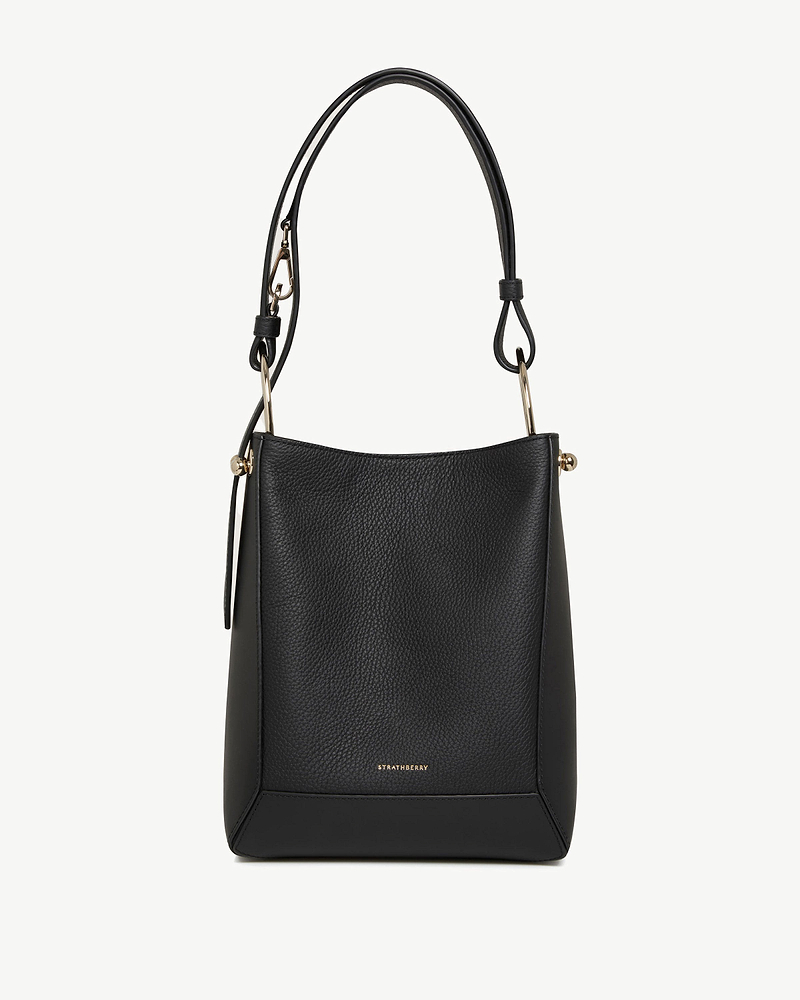 Black leather Strathberry Lana midi bucket bag with top handle and gold hardware