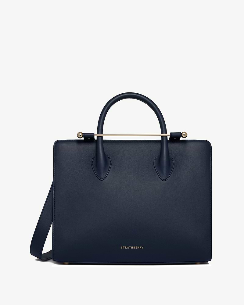 Marine blue midi tote with top handles, gold bar detail and Strathberry logo
