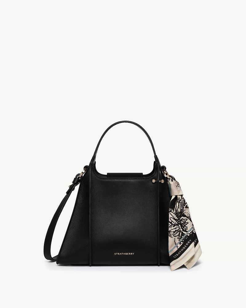 Black Strathberry Arkshell handbag with top handle, shoulder strap and tied scarf.