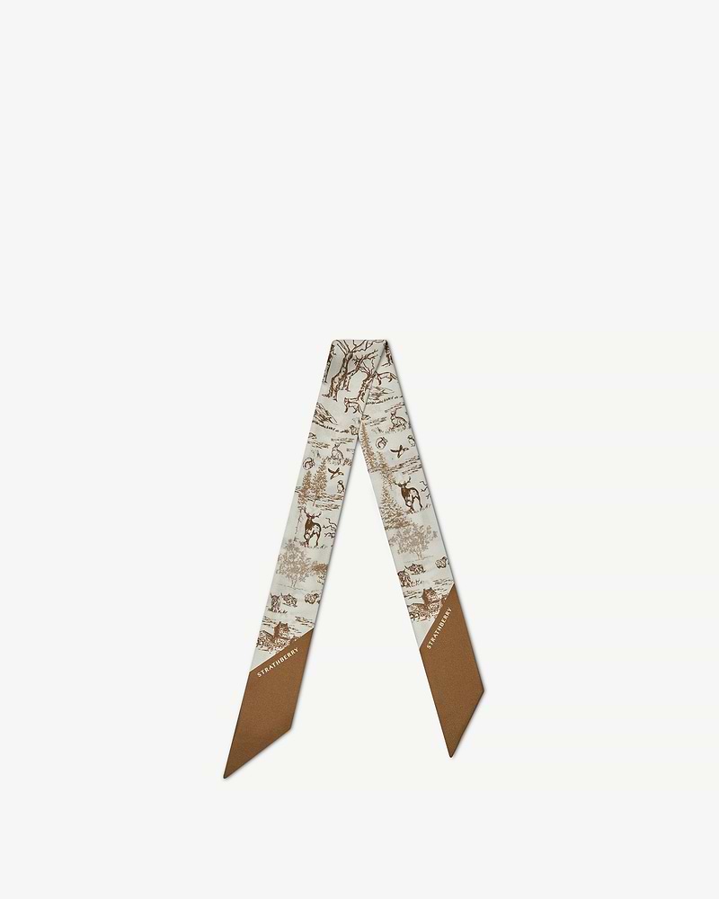 Silk skinny scarf with tan and vanilla animal wallpaper print and Strathberry logo.