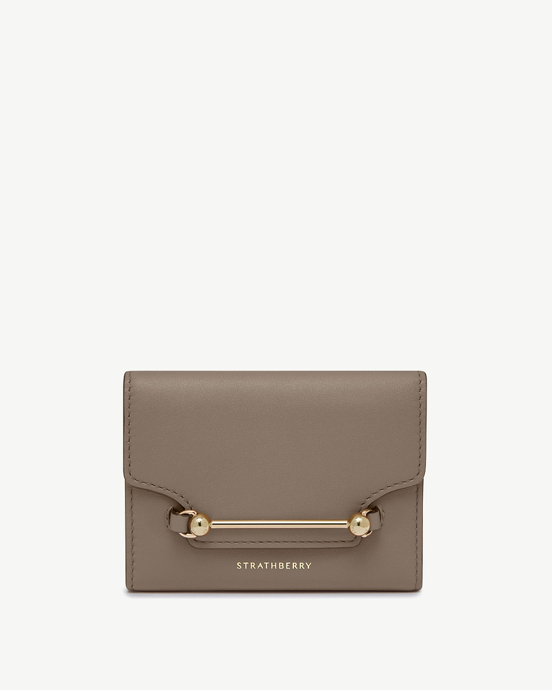 Strathberry Multrees trifold wallet in taupe leather with gold bar detail