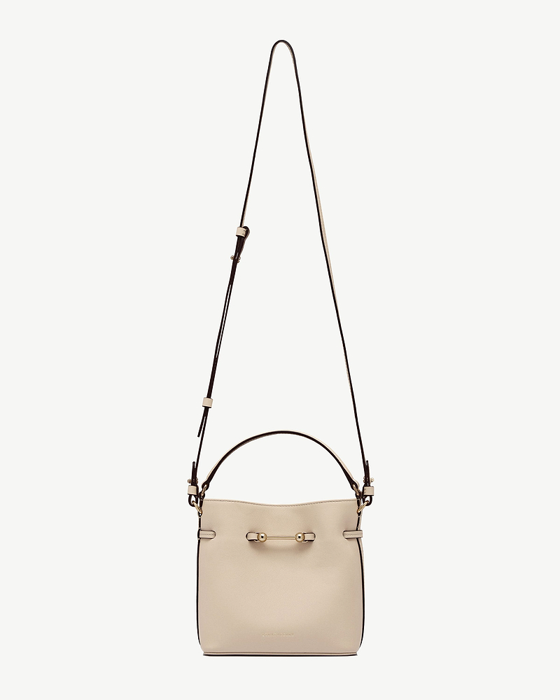 Oat mini bucket bag with long strap, top handle and gold bar detail