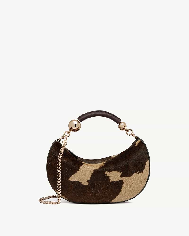 Crescent mini bag in sand and espresso spot print with gold chain strap.