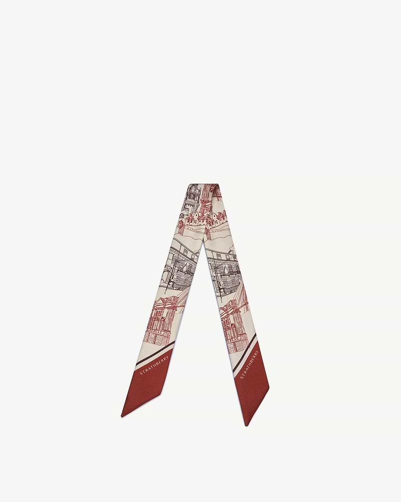 Silk skinny scarf with oxblood burgundy architectural print and Strathberry logo.