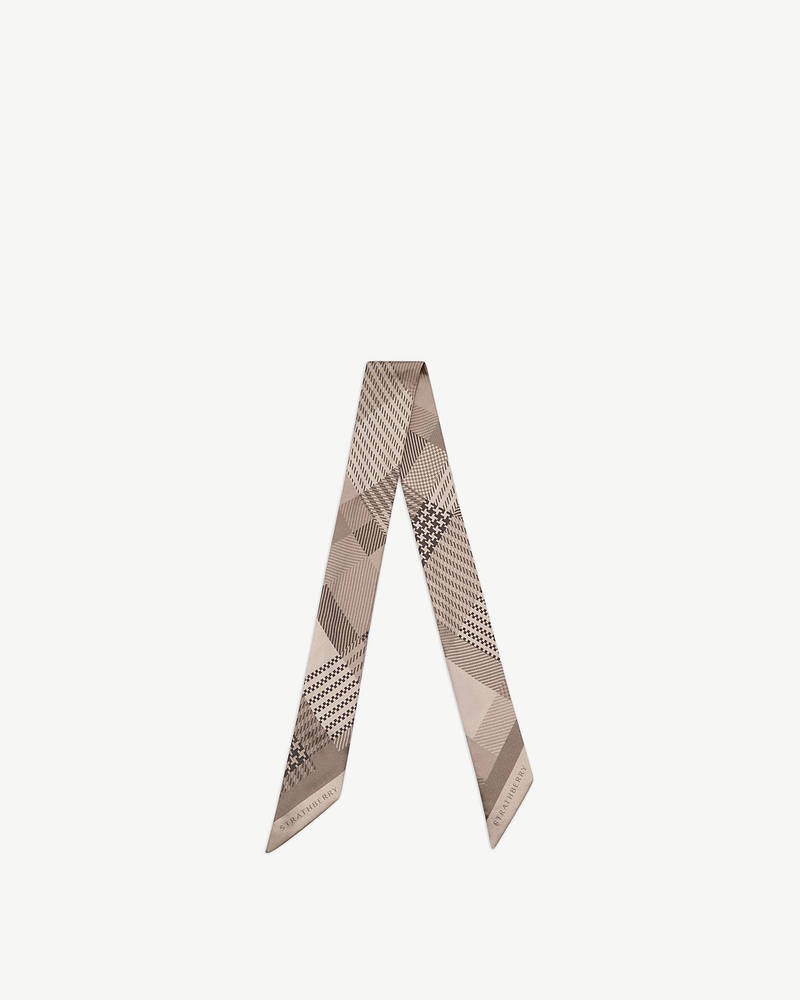 Silk skinny scarf in oat tartan with Strathberry wordmark, folded into a V shape.