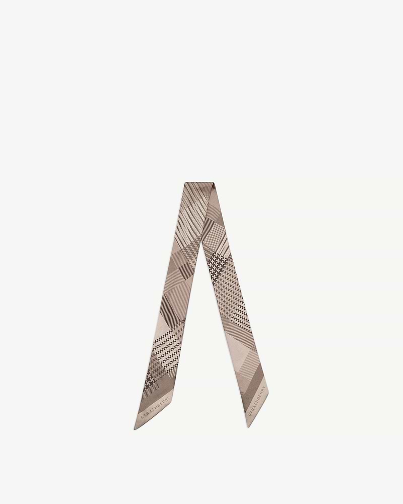Silk skinny scarf in oat tartan with Strathberry wordmark, folded into a V shape.