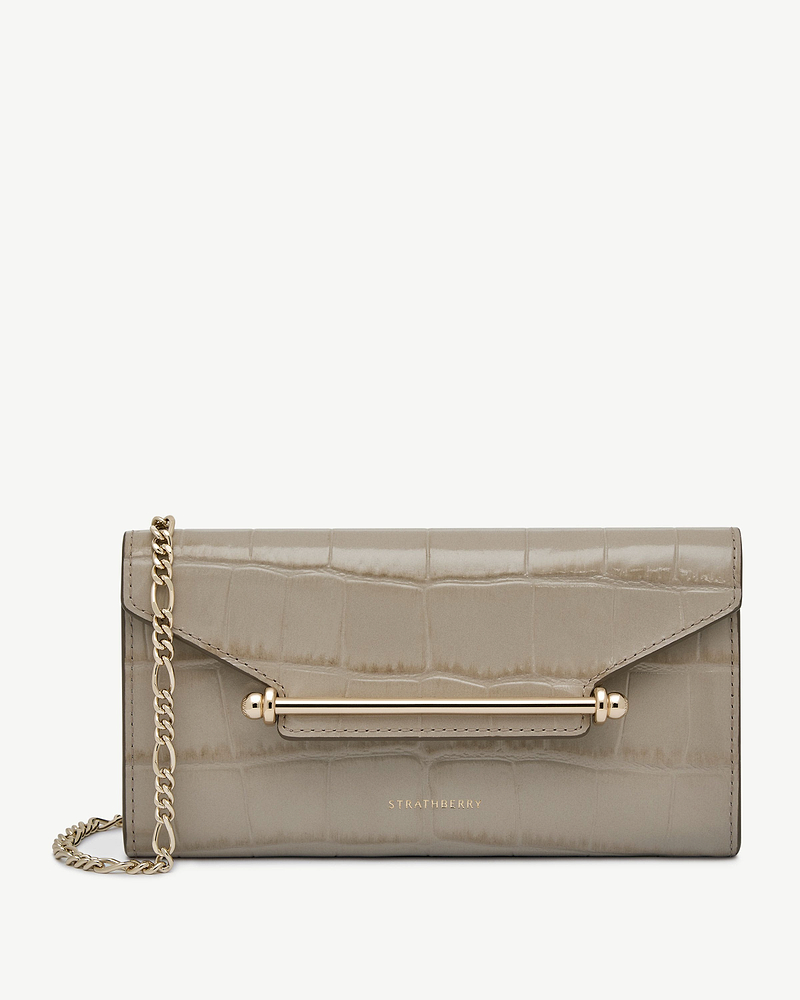Strathberry Multrees chain wallet in croc-embossed beige leather with gold hardware.