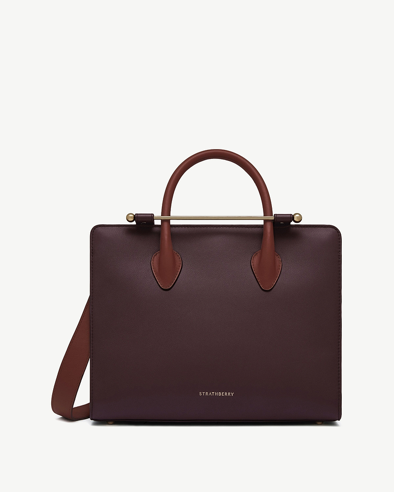 Strathberry midi tote in burgundy leather with walnut and chestnut handles and gold bar