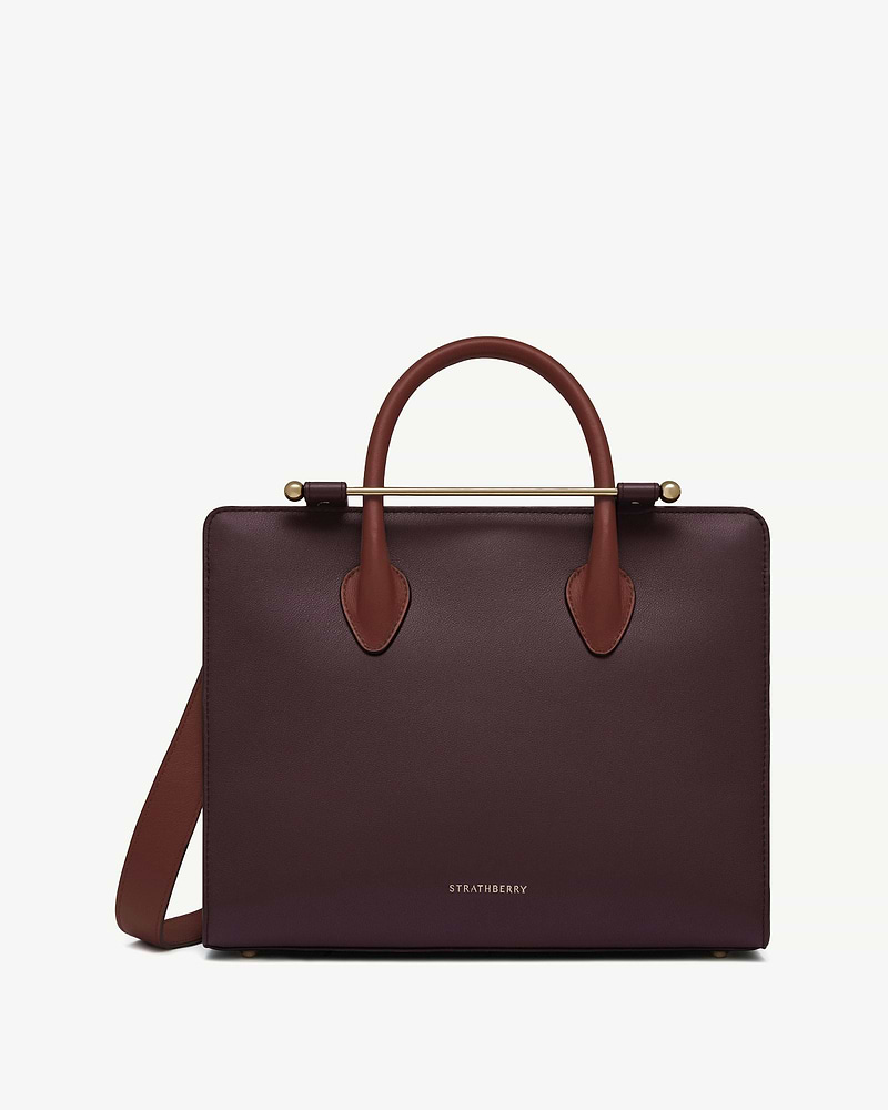 Strathberry midi tote in burgundy leather with walnut and chestnut handles and gold bar