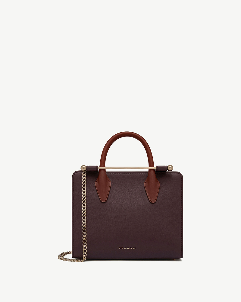 Strathberry mini tote in burgundy with chestnut handles, walnut trim and gold chain