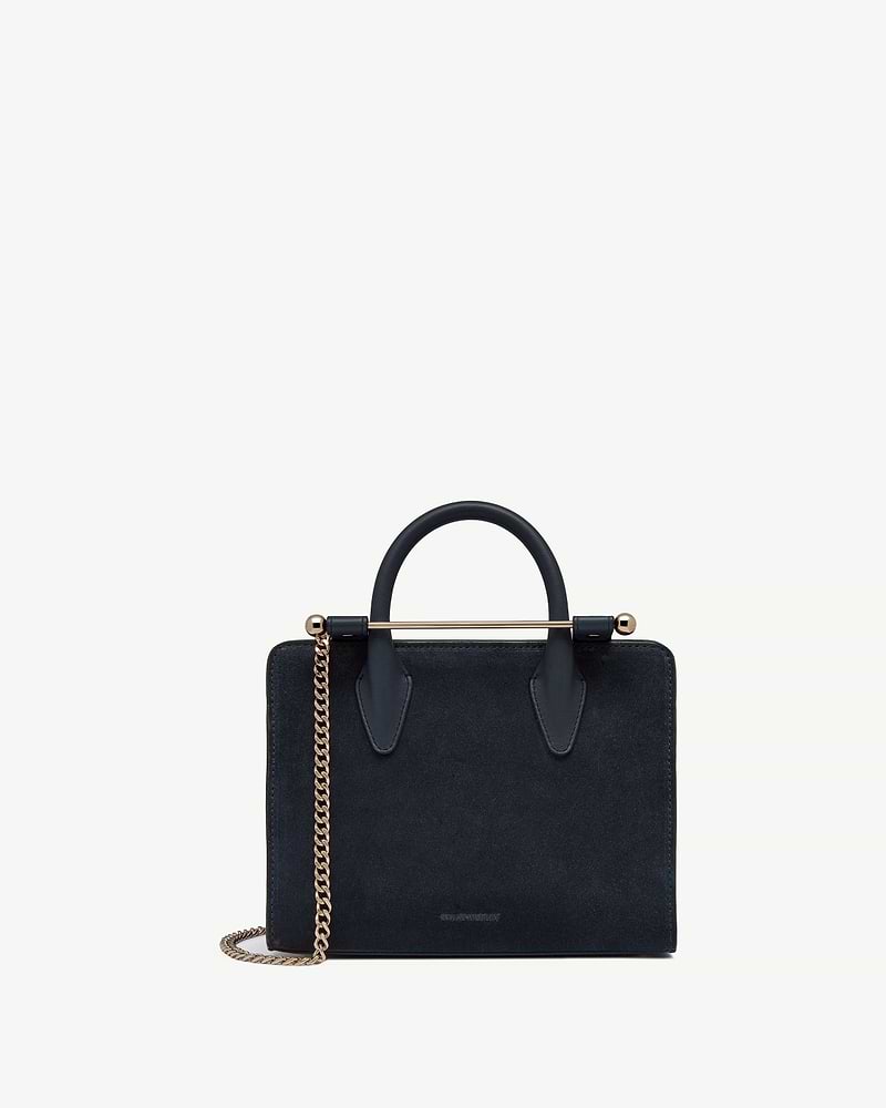 Strathberry mini tote in navy suede with gold chain and bar handle
