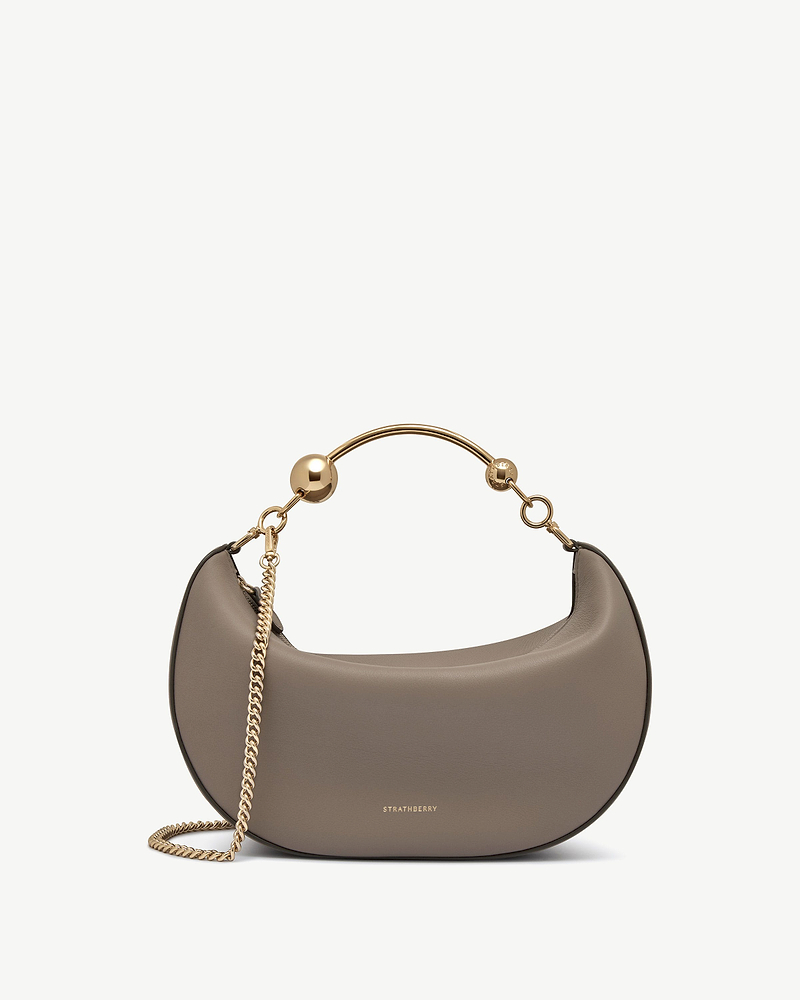 Taupe crescent moon bag with gold chain and Strathberry logo