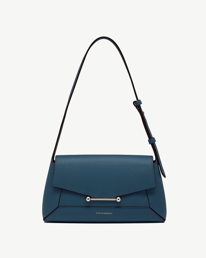 Strathberry mosaic shoulder bag in loch blue with gold bar hardware.