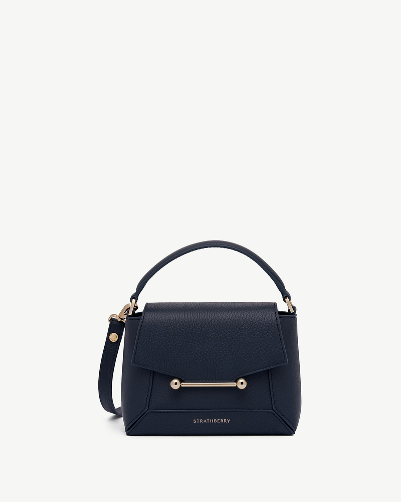 Strathberry Mosaic Nano navy leather bag with top handle and gold bar detail