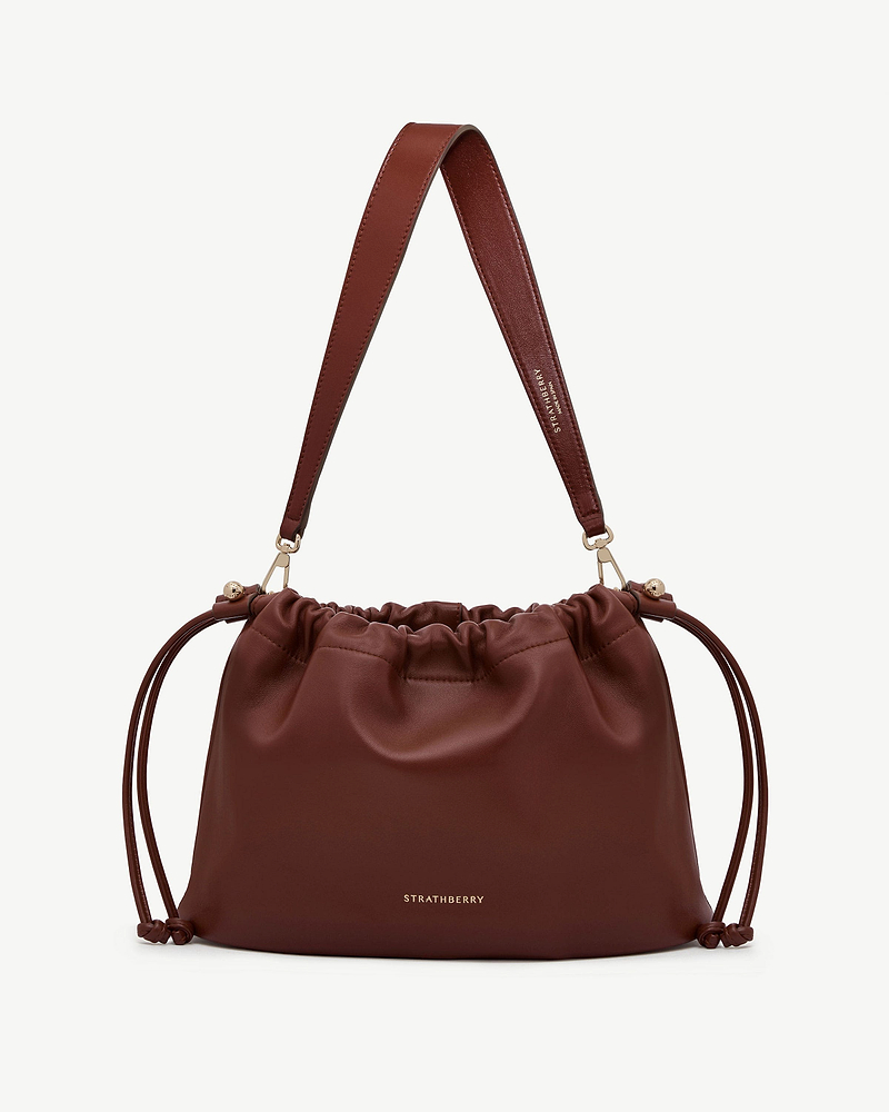 Strathberry Charlotte midi drawstring bag in walnut with leather shoulder strap