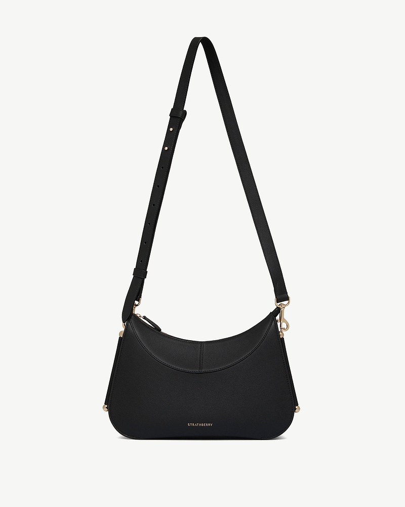 Black Strathberry Nest shoulder bag with adjustable strap and gold hardware.