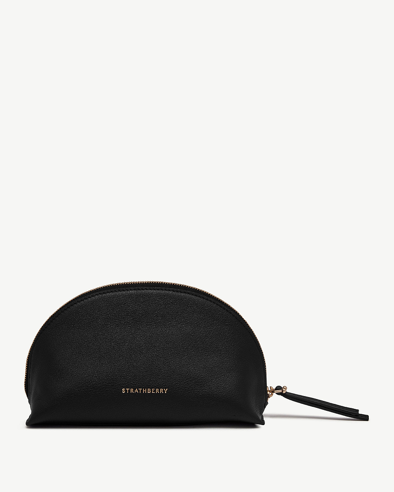 Black Nest pouch with gold Strathberry logo and leather tassel zip pull.