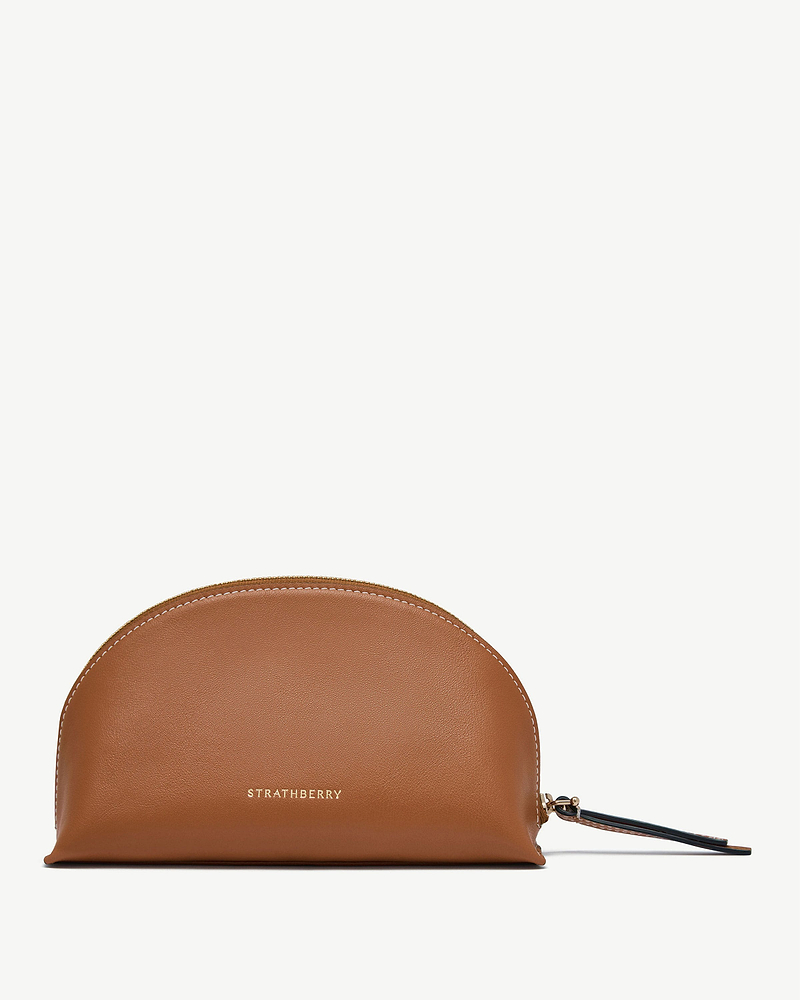Tan leather Nest Pouch with Strathberry logo and side wrist strap