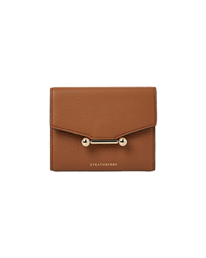 Tan Strathberry Mosaic trifold wallet with gold bar-and-ball closure and pebble leather.
