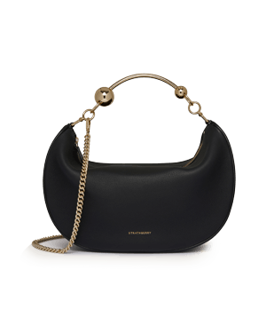 Black Strathberry crescent moon leather bag with gold arched handle and chain strap.