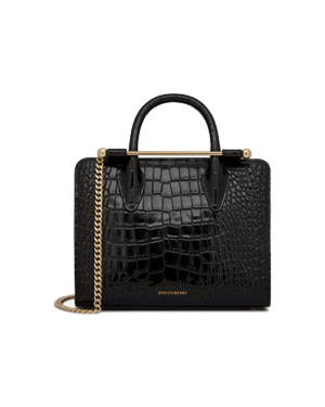 Black croc-embossed mini tote with top handles, gold chain strap, Strathberry logo.