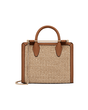 Tan mini tote with woven raffia body, leather trim and chain strap.