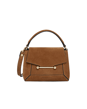 Tan suede top-handle mini bag with front flap and gold metal bar detail.
