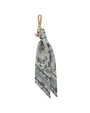 Strathberry silk charm in green thistle print with gold clip and bell.