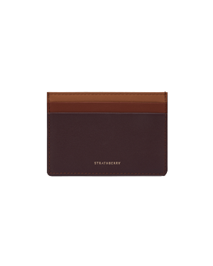 Three-colour burgundy, walnut and chestnut leather cardholder with Strathberry logo at bottom centre