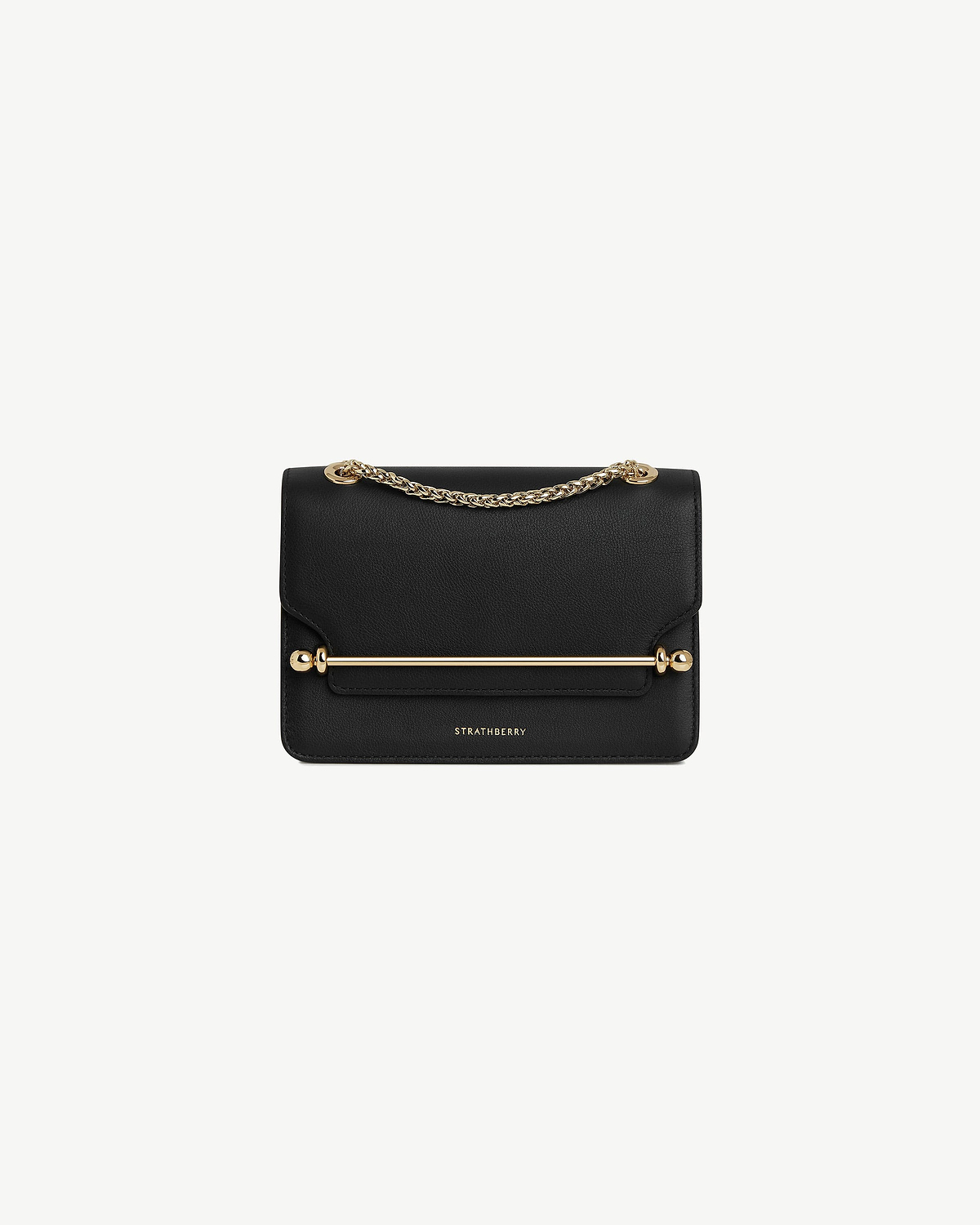 Black East/West Mini bag with gold bar and chain handle, Strathberry logo.